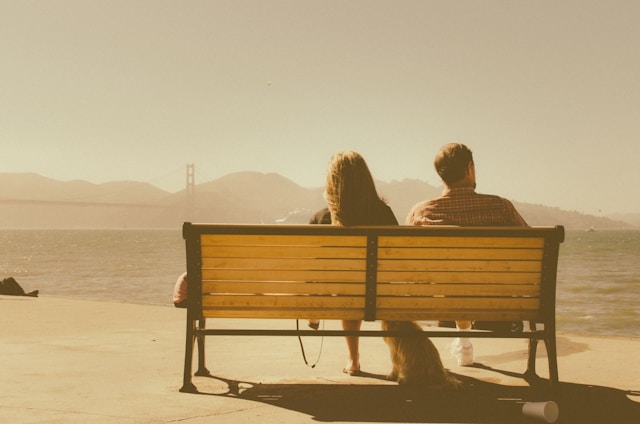 getting our own needs met in a relationship shown by couple on a bench